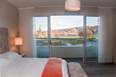 Bedroom looking out through balcony